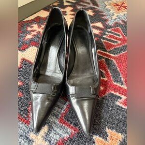 Prada black leather kitten heels. Has some scaffing and peeling. Size 38